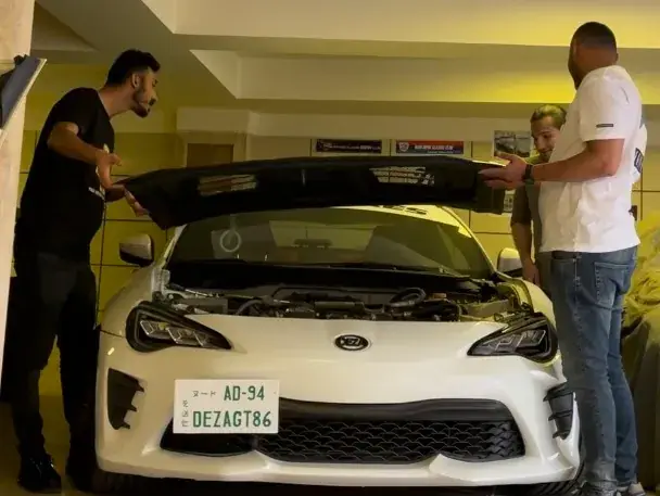 Friends fitting the carbon bonnet