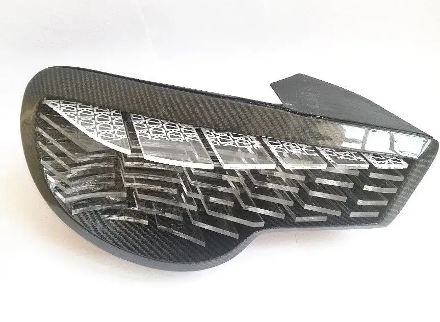 Finished carbon taillight with engraved NYX pattern
