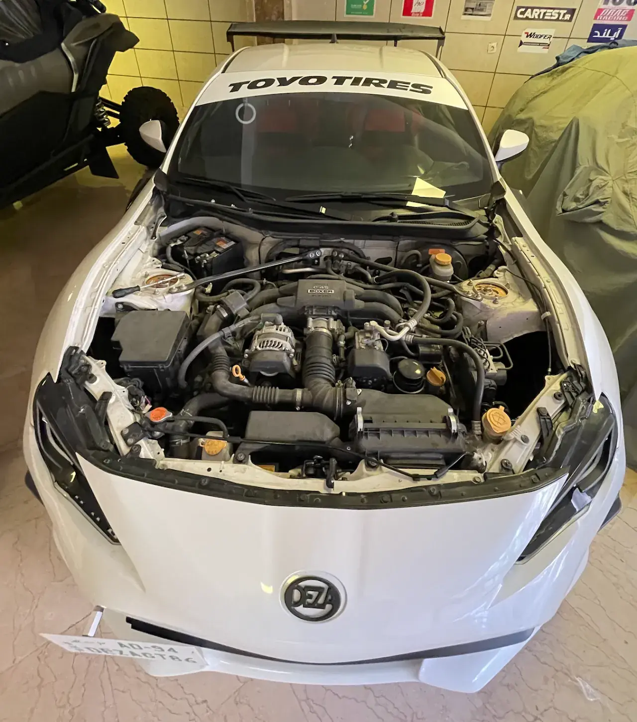 NYX engine bay with Toyo Tires sunstrip