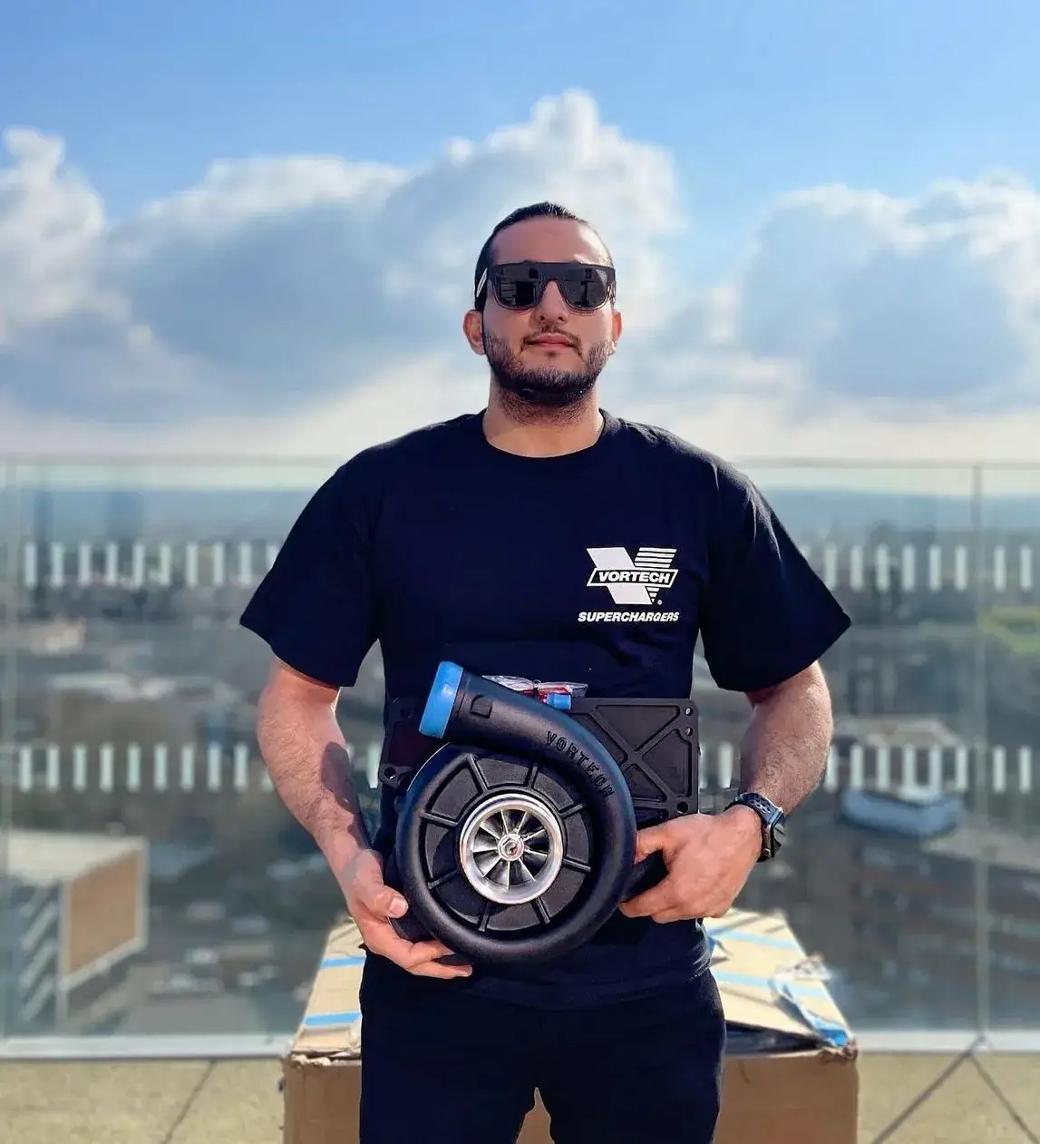 The owner holding the Vortech supercharger
