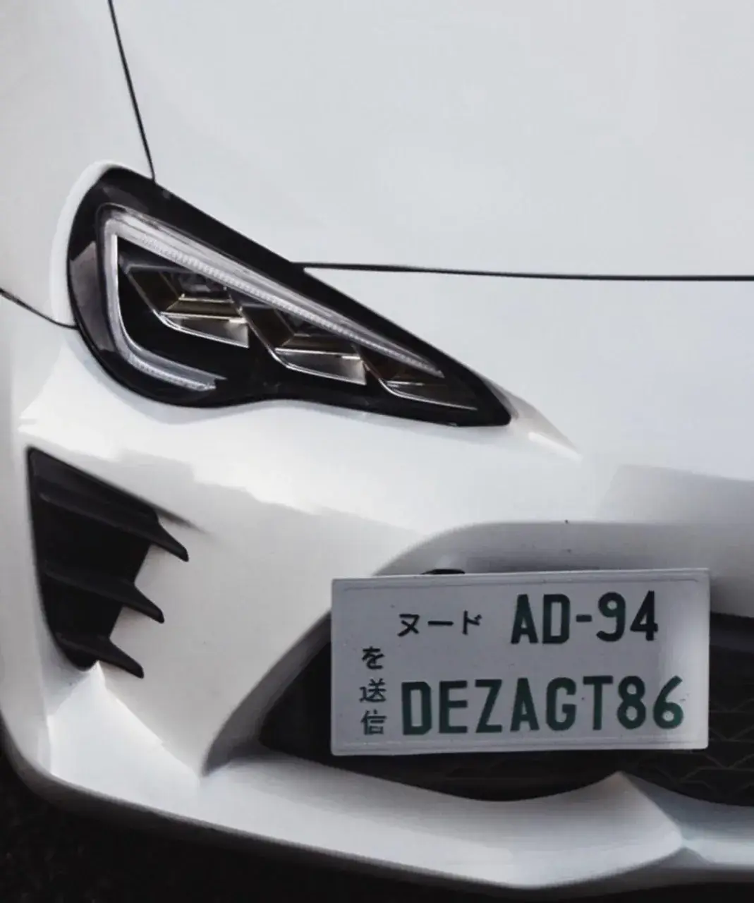 Headlight and DEZAGT86 number plate